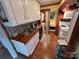 Open kitchen with wood countertops and laundry access at 105 Richard Dr, New London, NC 28127