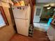 Full-size refrigerator in a galley-style kitchen at 105 Richard Dr, New London, NC 28127