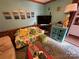 Beach-themed living room with ample seating and storage at 105 Richard Dr, New London, NC 28127