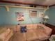 Relaxing living room featuring a sectional sofa and beach theme at 105 Richard Dr, New London, NC 28127