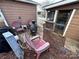 Cozy patio with fire pit and seating area, perfect for relaxing outdoors at 105 Richard Dr, New London, NC 28127