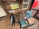 Small patio table and chairs with lake house decor at 105 Richard Dr, New London, NC 28127