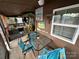 Screened porch with patio furniture and tiki bar at 105 Richard Dr, New London, NC 28127