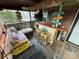 Relaxing screened porch with comfy seating and a tiki bar at 105 Richard Dr, New London, NC 28127