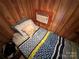 Small bedroom featuring a twin bed and AC unit at 105 Richard Dr, New London, NC 28127