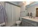 Functional bathroom featuring a shower with white curtains, a toilet, and a vanity at 1077 Sardis Cove Dr, Charlotte, NC 28270