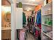 Walk-in closet with lots of clothes and storage space, and a view into the bathroom at 1077 Sardis Cove Dr, Charlotte, NC 28270