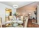 Elegant dining room with glass table and chairs, view to the living room and kitchen at 1077 Sardis Cove Dr, Charlotte, NC 28270