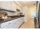 Well-maintained kitchen with granite countertops, white cabinets, and stainless steel sink at 1077 Sardis Cove Dr, Charlotte, NC 28270