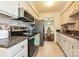Updated kitchen featuring stone counters, stainless appliances and convenient tile floor at 1077 Sardis Cove Dr, Charlotte, NC 28270