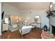 Bright living room with vaulted ceilings, fan, hardwood floors, and stylish furnishings at 1077 Sardis Cove Dr, Charlotte, NC 28270