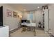 Well-lit home office featuring a modern desk, stylish decor, and a comfortable seating area at 1077 Sardis Cove Dr, Charlotte, NC 28270