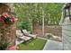 Relaxing patio featuring lounge chairs with colorful pillows and lush greenery at 1077 Sardis Cove Dr, Charlotte, NC 28270