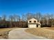 Two-story house with a two-car garage and a light brown exterior at 110 Oak Crossing Dr, Shelby, NC 28152