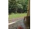 Balcony with black railing and outdoor seating, offering serene views of lush trees at 11041 Cedar View Rd, Charlotte, NC 28226
