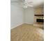 Open living room with a decorative fireplace and light, airy feel with floors that complement the space at 11041 Cedar View Rd, Charlotte, NC 28226