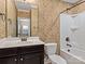 Bathroom with shower/tub combo and dark vanity at 11052 Preservation Park Dr, Charlotte, NC 28214