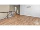 Spacious bonus room featuring hardwood floors with stairway access at 11052 Preservation Park Dr, Charlotte, NC 28214