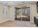 Bright breakfast nook with sliding glass doors leading to a screened porch at 11052 Preservation Park Dr, Charlotte, NC 28214