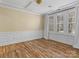 Formal dining room with hardwood floors and large windows at 11052 Preservation Park Dr, Charlotte, NC 28214