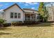 Back of house and outdoor patio with lush green yard at 11052 Preservation Park Dr, Charlotte, NC 28214