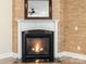 Cozy corner fireplace with a modern white mantel and dark stone hearth at 11052 Preservation Park Dr, Charlotte, NC 28214
