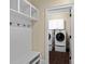 Well-organized laundry room featuring modern appliances, storage, and hanging space at 11052 Preservation Park Dr, Charlotte, NC 28214