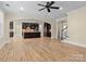 Open living room with hardwood floors, a kitchen, and staircase at 11052 Preservation Park Dr, Charlotte, NC 28214