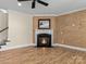 Living room with fireplace, hardwood floors and built-in shelving at 11052 Preservation Park Dr, Charlotte, NC 28214