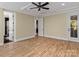 Main bedroom with hardwood floors and access to en-suite bathroom at 11052 Preservation Park Dr, Charlotte, NC 28214