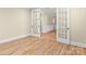 Home office with French doors and hardwood floors at 11052 Preservation Park Dr, Charlotte, NC 28214