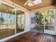 Enclosed porch with wood flooring and a ceiling fan, perfect for relaxing and enjoying outdoors at 11052 Preservation Park Dr, Charlotte, NC 28214