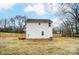 Back view of the home highlighting the backyard, wooden deck, and newly constructed wooden fence at 113 Wylie Park Rd, Lancaster, SC 29720