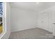 Neutral bedroom with carpet flooring and a double door closet at 1310 Essex St, Gastonia, NC 28052