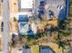 An aerial view of a home with a gray roof near a parking lot and treed area at 132 N Confederate Ave, Rock Hill, SC 29730