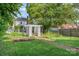 Lush backyard featuring a garden with pergola and greenhouse, perfect for gardening enthusiasts at 132 N Confederate Ave, Rock Hill, SC 29730