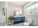 Bathroom with double sinks, glass enclosed shower, modern fixtures, and a bright window at 132 N Confederate Ave, Rock Hill, SC 29730