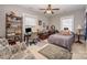 Cozy bedroom featuring neutral walls, ceiling fan, desk, and vintage furniture, creating a comfortable living space at 132 N Confederate Ave, Rock Hill, SC 29730