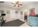 Bonus room with a ceiling fan, blue dresser, fitness equipment, and view of the ensuite bathroom at 132 N Confederate Ave, Rock Hill, SC 29730