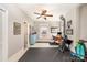 Bonus room with a ceiling fan, home gym, blue dresser, and view of the ensuite bathroom at 132 N Confederate Ave, Rock Hill, SC 29730