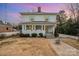 Charming two-story home with a welcoming front porch and cheerful blue shutters at 132 N Confederate Ave, Rock Hill, SC 29730