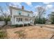 Charming two-story home with a welcoming front porch and cheerful blue shutters at 132 N Confederate Ave, Rock Hill, SC 29730