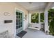 Inviting front porch with a swing, charming teal door, and classic architectural details at 132 N Confederate Ave, Rock Hill, SC 29730