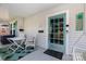 Inviting front porch with a charming teal door and rocking chairs, perfect for relaxation at 132 N Confederate Ave, Rock Hill, SC 29730