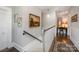 Hallway features hardwood floors, detailed trim and access to rooms with natural lighting at 132 N Confederate Ave, Rock Hill, SC 29730