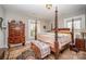 Main bedroom features hardwood floors, natural lighting and a four post bed at 132 N Confederate Ave, Rock Hill, SC 29730