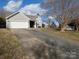 Gray house with white garage doors and driveway at 14333 Blue Granite Rd # 25, Pineville, NC 28134