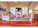 Living room with hardwood floors, fireplace, and large windows, plenty of natural light at 15816 Feeny Ct, Charlotte, NC 28278