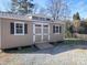 Tan colored storage shed with double doors and ramp at 1627 N Main St, Salisbury, NC 28144