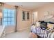 Charming bedroom with a daybed, decorative pillows, and framed wall art at 1797 Otter Perch Ln, Fort Mill, SC 29715